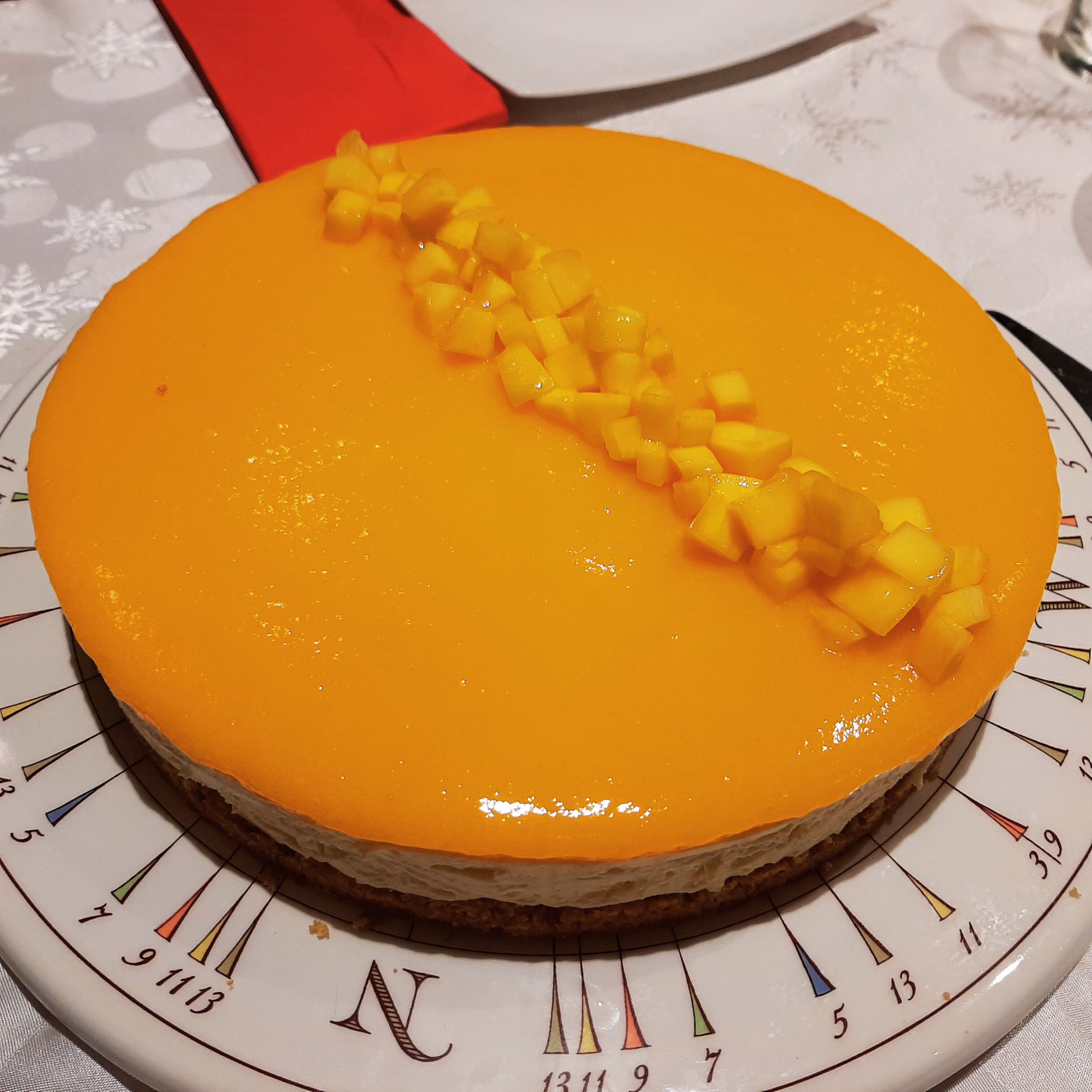Mango cheesecake topped with a glossy mango layer