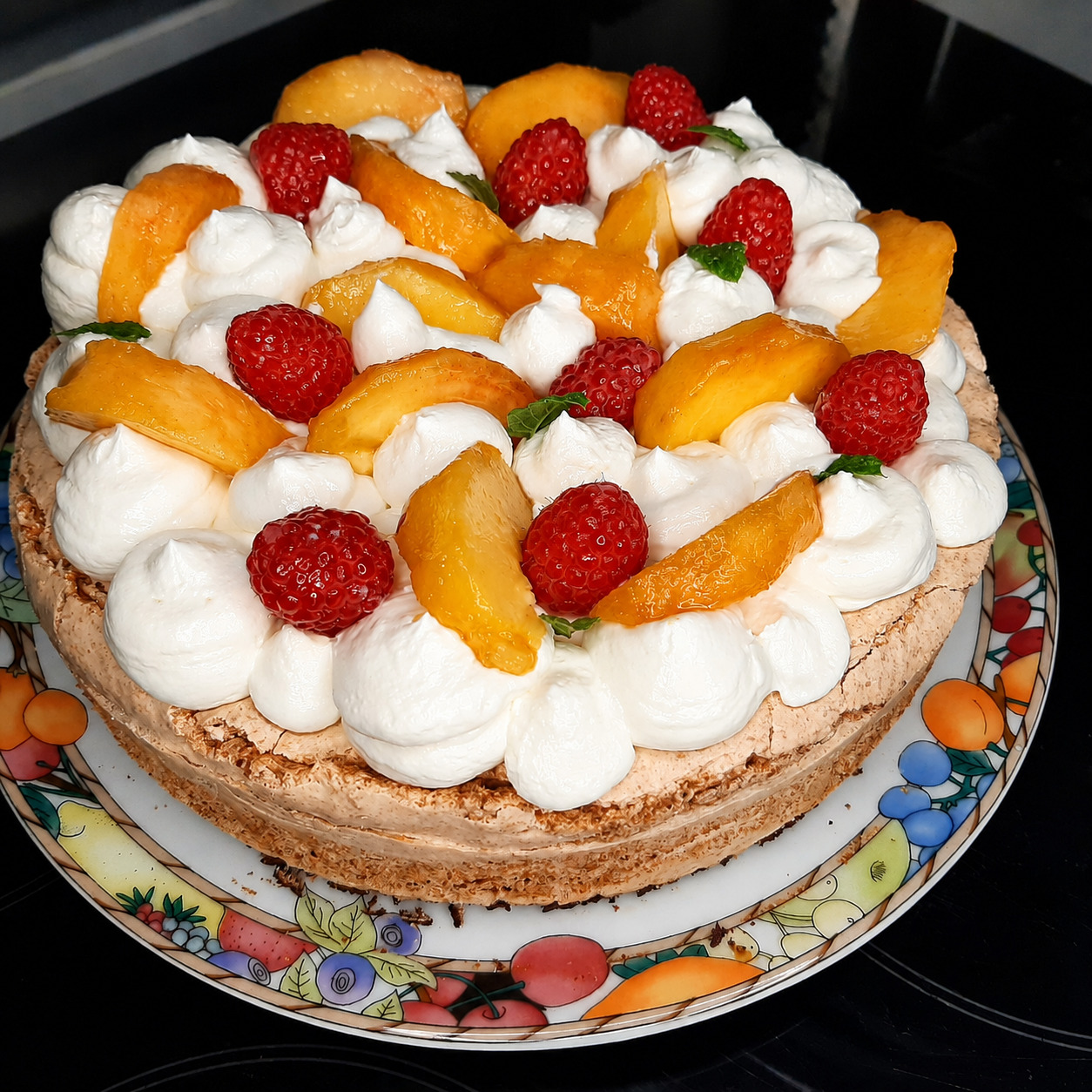 Almond cake with peaches on a serving plate